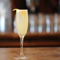 gin or cognac, fresh lemon juice, champagne